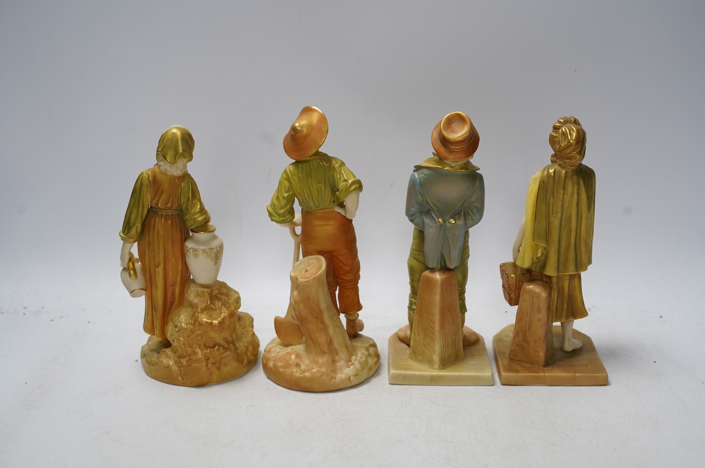 Four Worcester figures comprising 1874, 1810 and 835, one signed Hadley, largest 17cm high. Condition - good